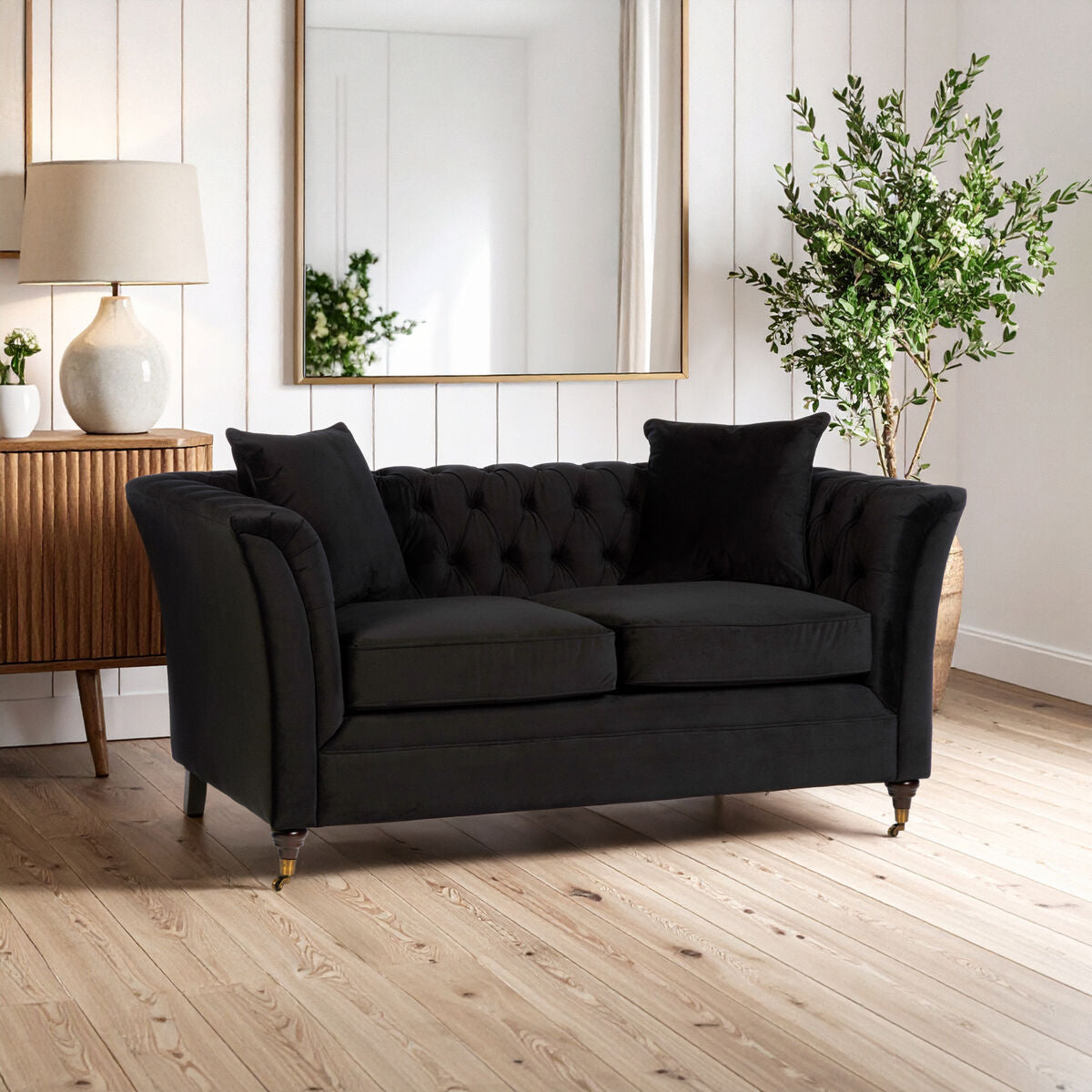 Black velvet tufted sabrina 2-seat onyx sofa with rolled arms and dark wooden legs perfect for cozy seating