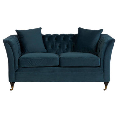 Deep navy velvet sabrina two seat sofa with tufted back rolled arms and ornate brass legs for stylish seating