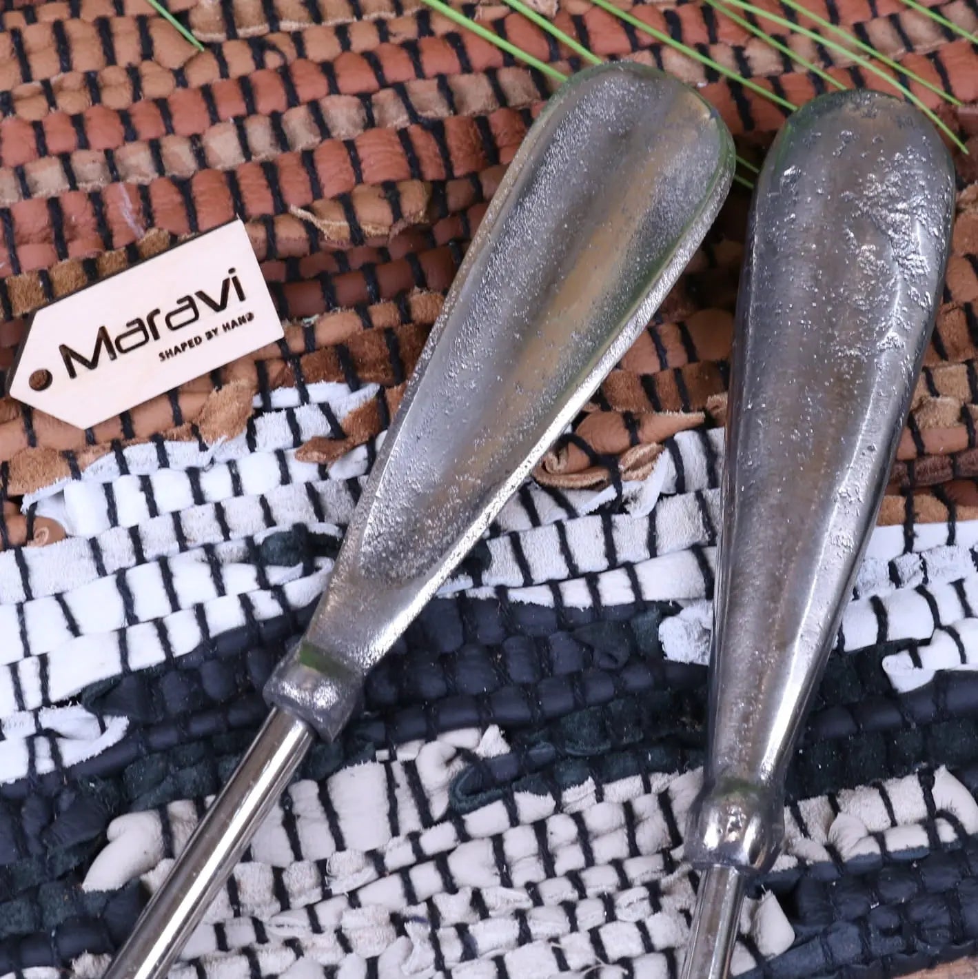 Two metallic sagara long handled shoe horns with brushed silver finish and slightly tapered rounded handles