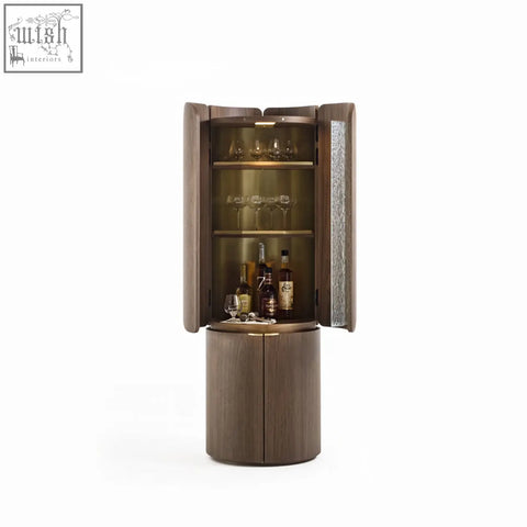 Modern cylindrical sakamoto liquor cabinet with dark wood finish glass doors and illuminated shelves for bottles and glasses