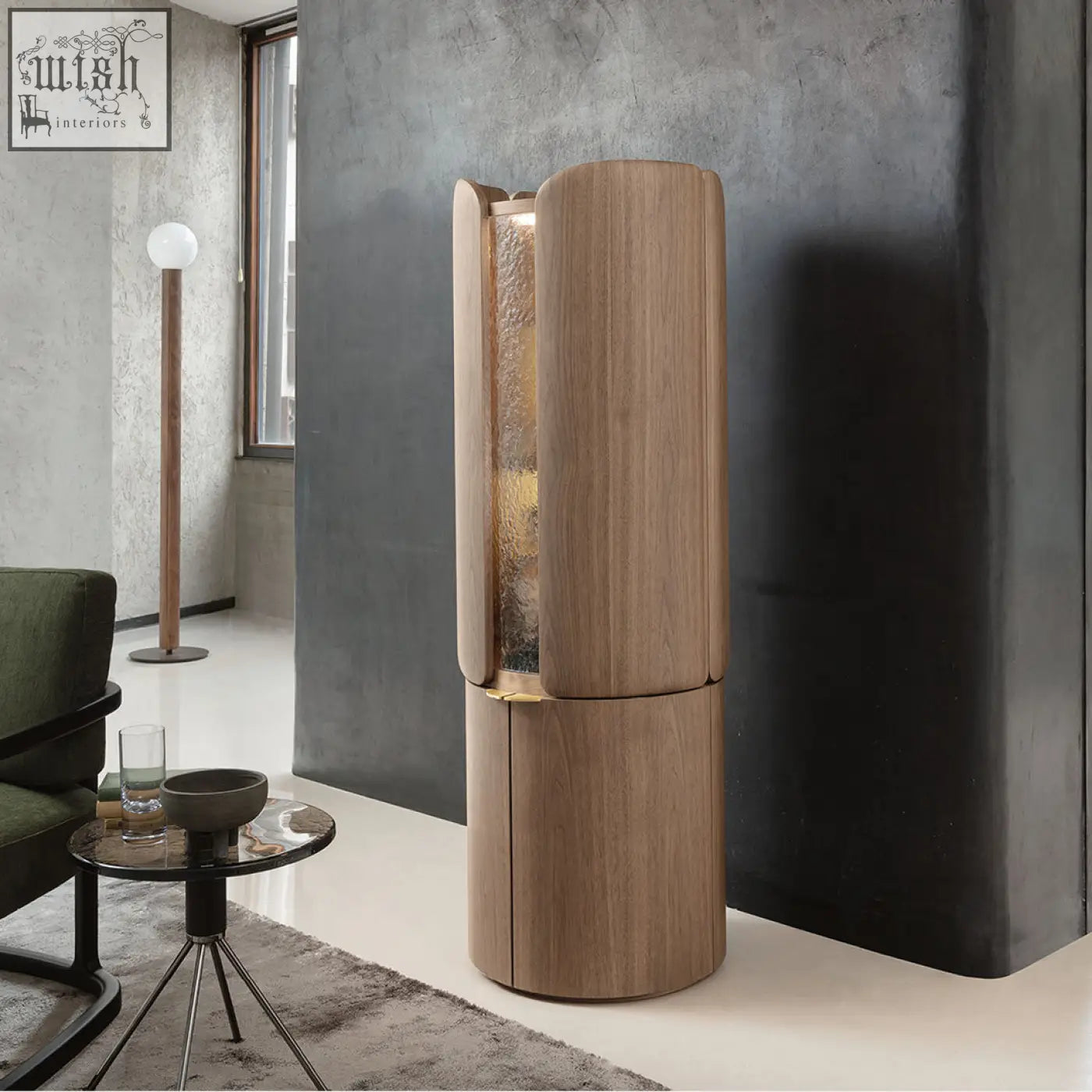 A sleek sakamoto liquor cabinet with cylindrical wooden design, textured glass panel, and gold-toned accents for wine storage