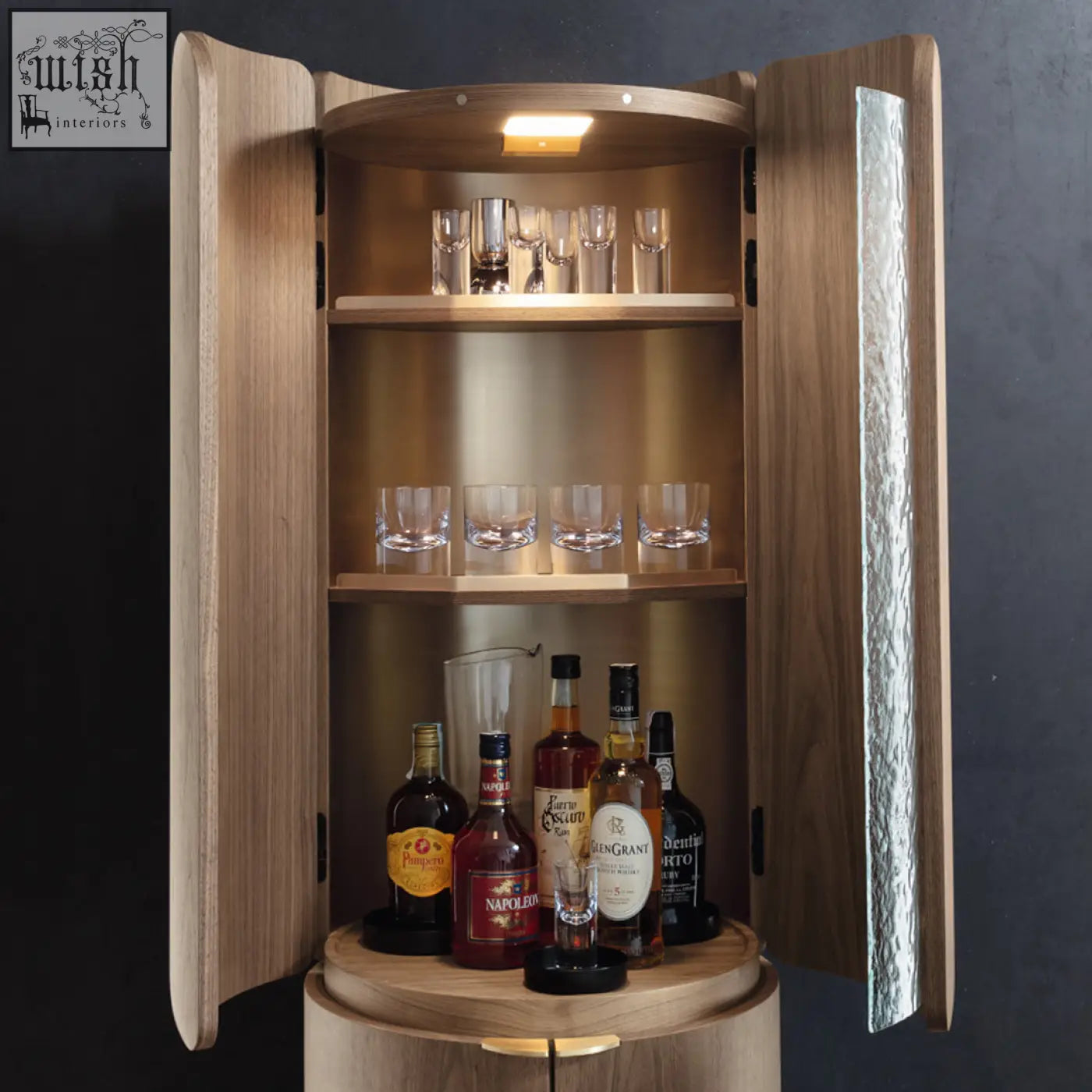 A sleek round wooden sakamoto liquor cabinet with textured metallic panel and warm lighting for wine storage