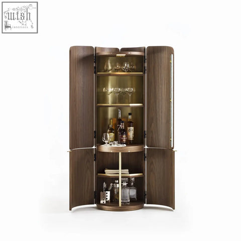 A sleek dark wood sakamoto liquor cabinet with curved doors and brass accents for wine storage and liquor display