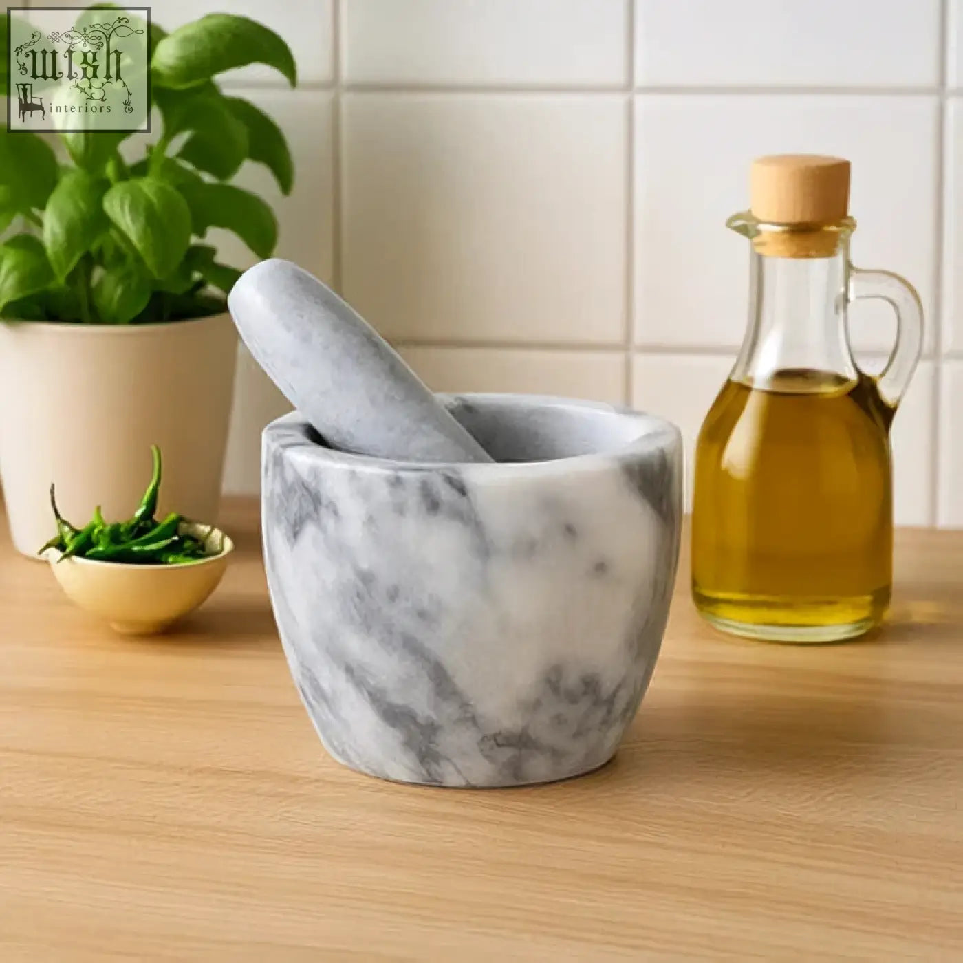 Salerno grey marble tapered mortar and pestle in grey marble with white marbled pattern on wooden countertop