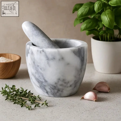 Salerno grey marble tapered mortar and pestle with fresh herbs and garlic for grinding and crushing ingredients
