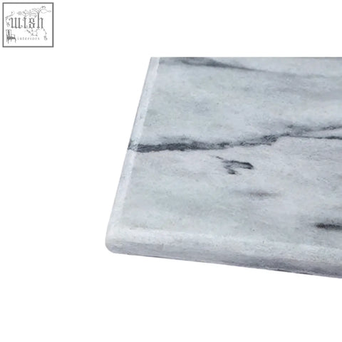Large white marble rectangular chopping board with subtle gray veining perfect for serving and prepping meals