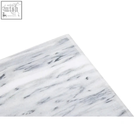Large white marble rectangular chopping and serving board with subtle gray veining and smooth surface