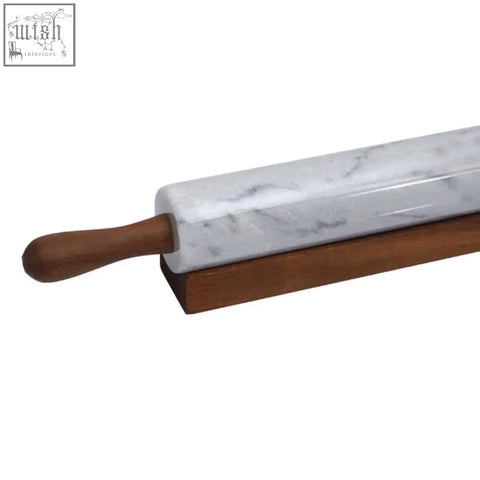 White marble rolling pin with dark brown wooden handles and base for smooth dough rolling tasks