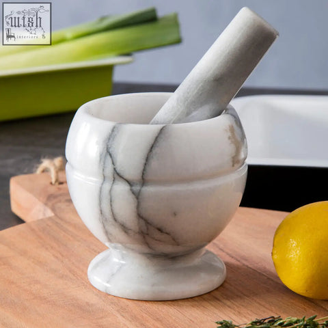 Salerno white marble small mortar and pestle set with gray veining on wooden cutting board for grinding herbs and spices