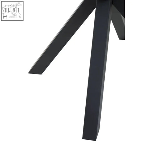 Black metal legs with a matte finish and modern angular design on the salford round dining table