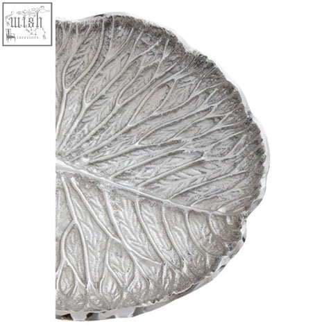 Silver finish lotus leaf plate with intricate vein detailing and textured metallic surface perfect for serving