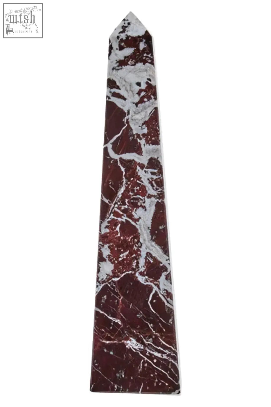A tall slender salmo large red marble obelisk with polished red and white marble and a pointed top