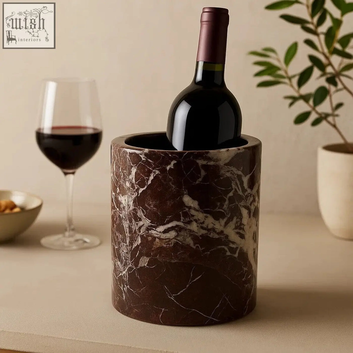 Salmo red marble wine cooler in brown marble with white veining holding a dark red wine bottle