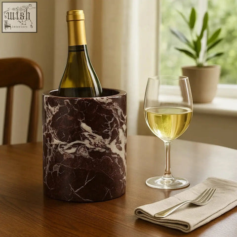 Salmo red marble wine cooler in dark brown marble with white veining holding a green glass bottle of wine