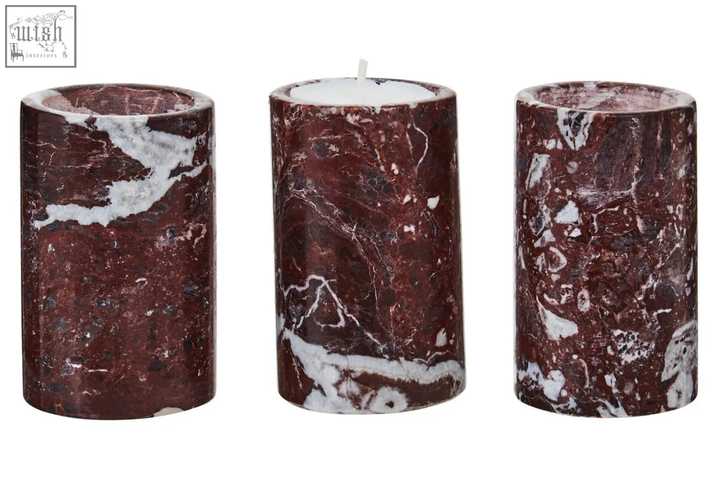 Three red marble tealight holders in deep burgundy with white veining one holding a lit tealight candle