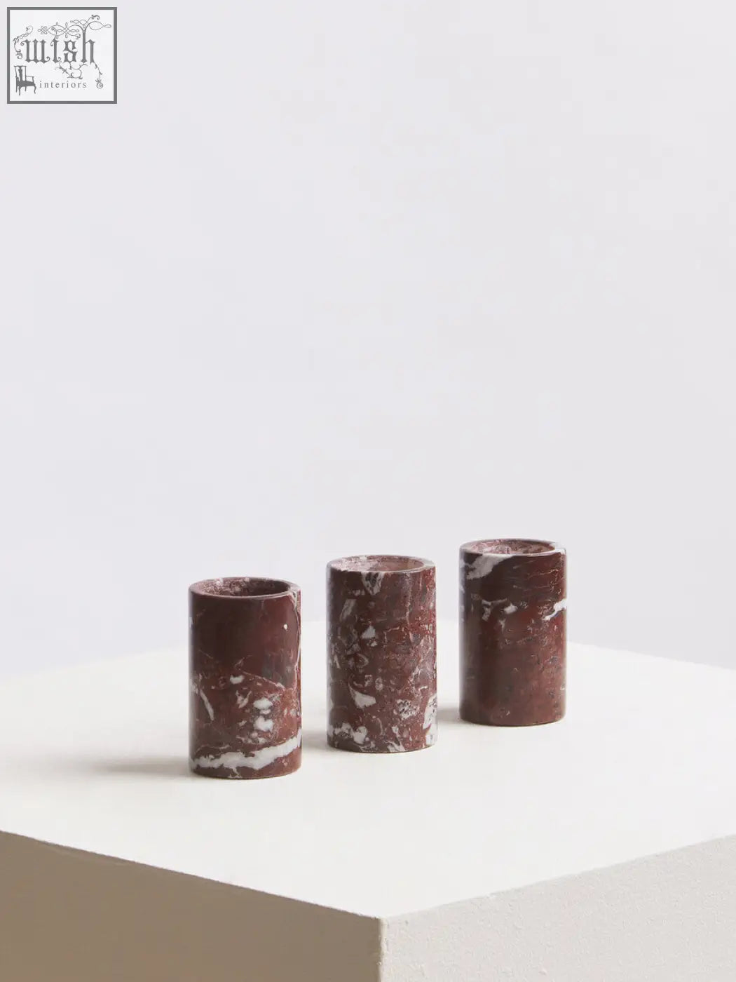 Salmo set of three red marble tealight holders with cylindrical design and rich burgundy base with white veining
