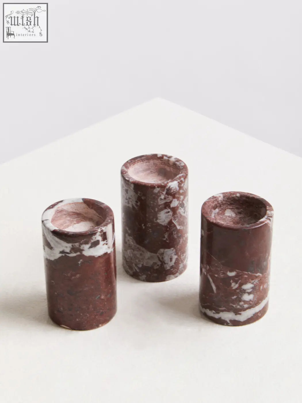 Salmo set of three red marble tealight holders with cylindrical shape and rich burgundy base with white veining
