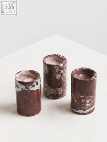 Salmo set of three red marble tealight holders with cylindrical shape and rich burgundy base with white veining