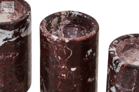 Salmo set of three red marble tealight holders in dark red marble with white and black veining cylindrical design