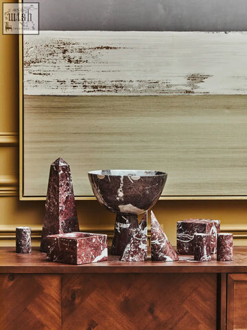 A striking burgundy and white marble tealight holder with bold veining from salmo set of three red marble holders