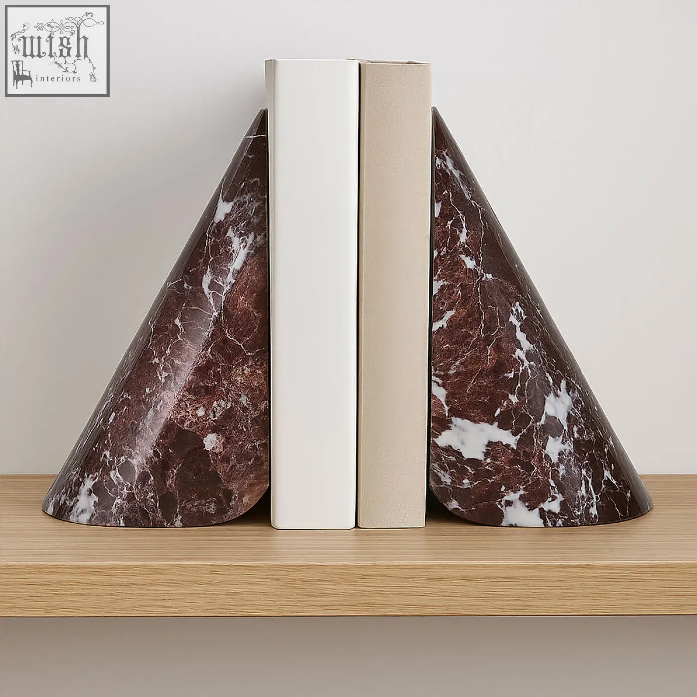 Salmo set of two red marble bookends with brown marble and white veining hold books on a wooden shelf