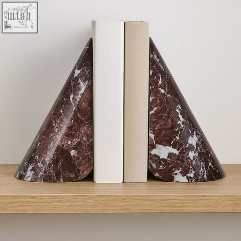 Salmo set of two red marble bookends with brown marble and white veining hold books on a wooden shelf