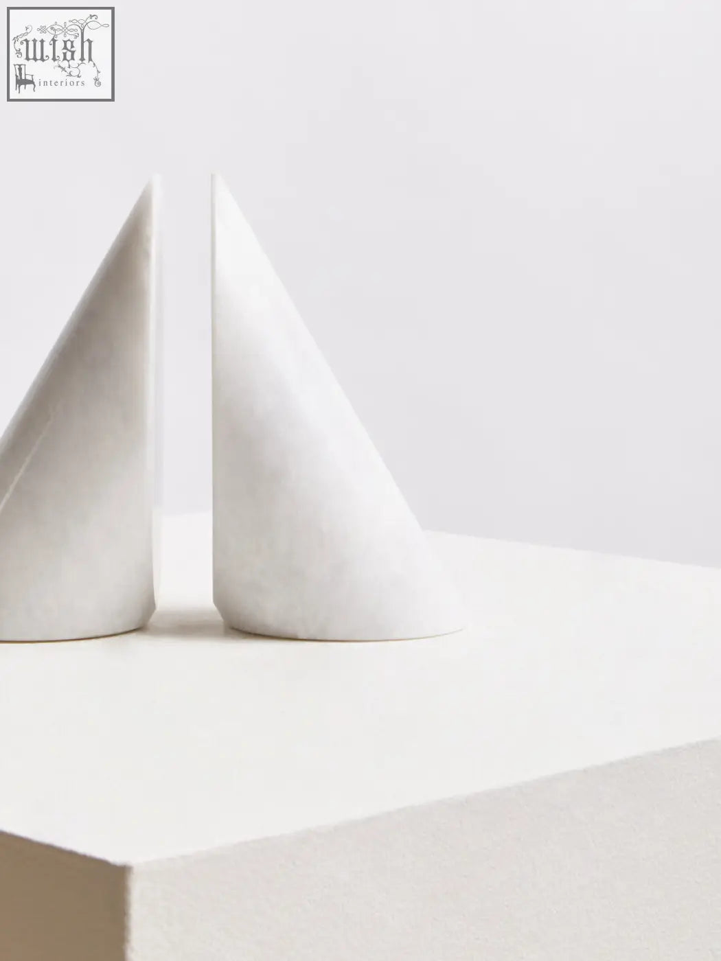 Salmo set of two white marble bookends in cone shape made of marble for stylish and functional bookshelf decor