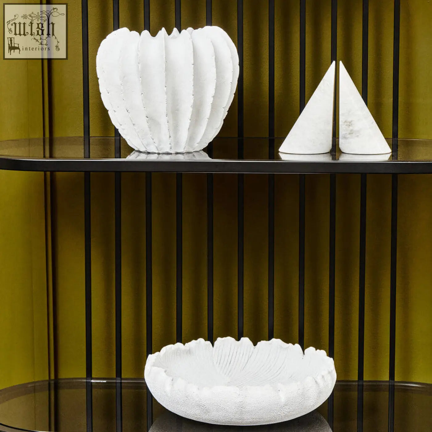 White textured ceramic vase with fluted petal ridges and scalloped rim paired with white marble bookends