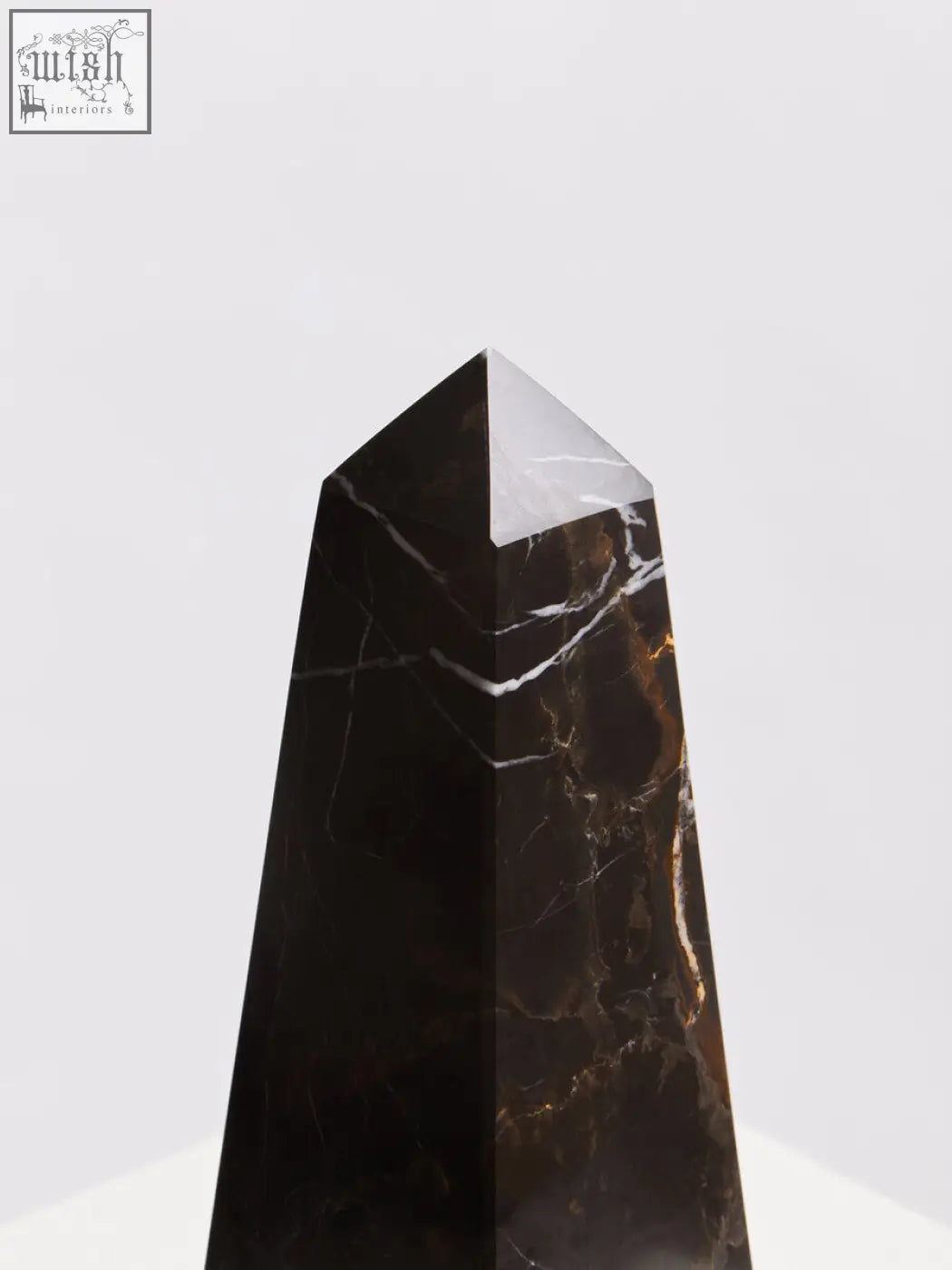 Salmo small black marble obelisk with striking white and gold veining topped by a polished silver pyramid