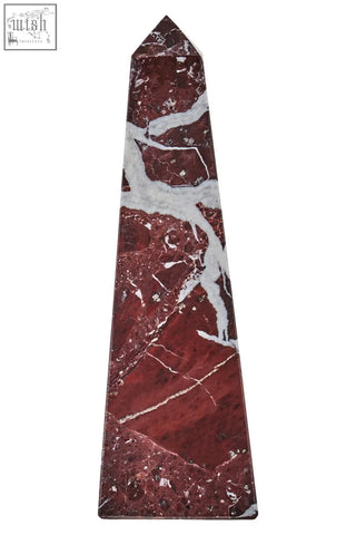 A polished salmo small red marble obelisk with striking white veining perfect as a small red marble decor piece