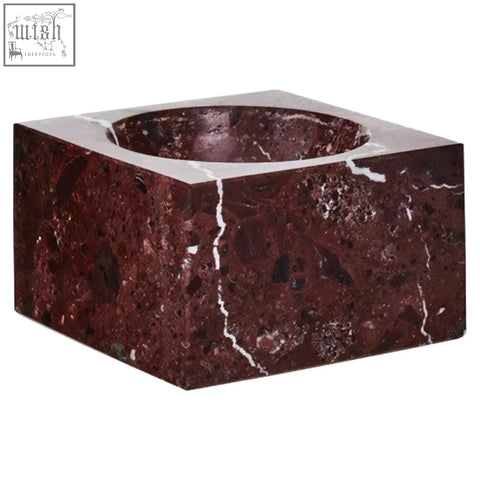 A salmo square red marble bowl candle holder with a smooth polished surface and deep burgundy red marble finish