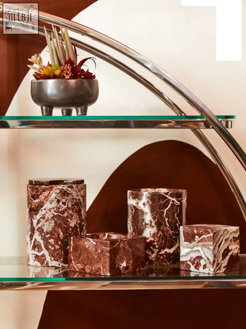 Brown and white marble cylindrical and square containers featuring the salmo square red marble bowl design