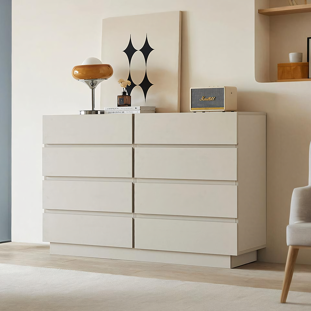 Cream-colored salome drawer cabinet with eight sleek drawers in a minimalist modern design for stylish storage