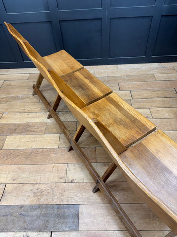 Rustic light brown oak church chairs folding bench with curved backrest and slatted seat for hallway seating
