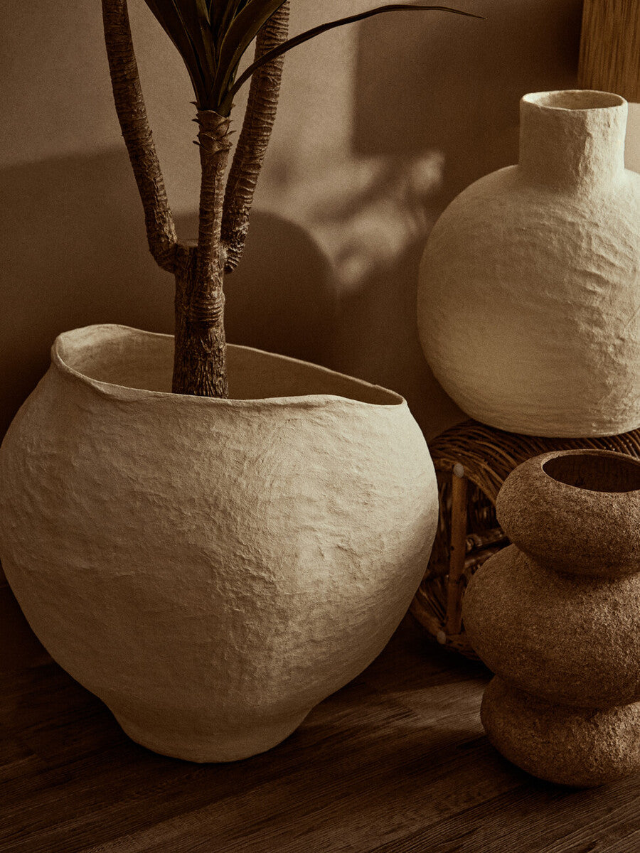 Cream-colored large beige planter with textured ceramic and wide opening in an organic handcrafted shape sanai cotton mache