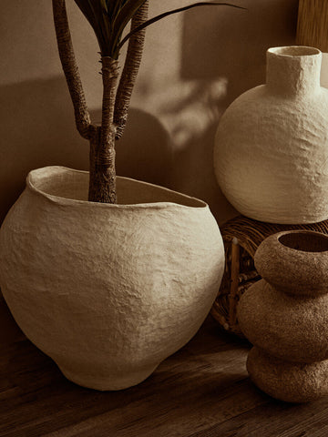 Cream-colored large beige planter with textured ceramic and wide opening in an organic handcrafted shape sanai cotton mache