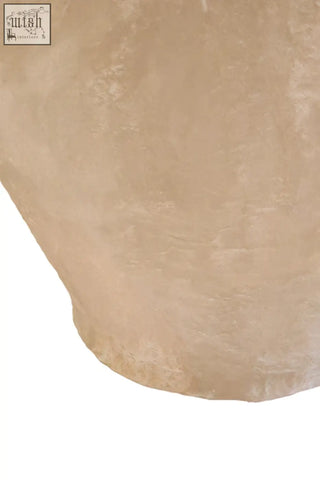 A translucent pale pink salt crystal featured on the decorative handles of the sanai cotton mache large vase