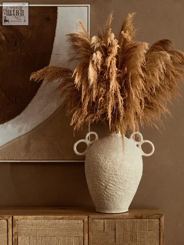 Sanai cotton mache large vase in off-white with decorative circular handles holding dried pampas grass bouquet