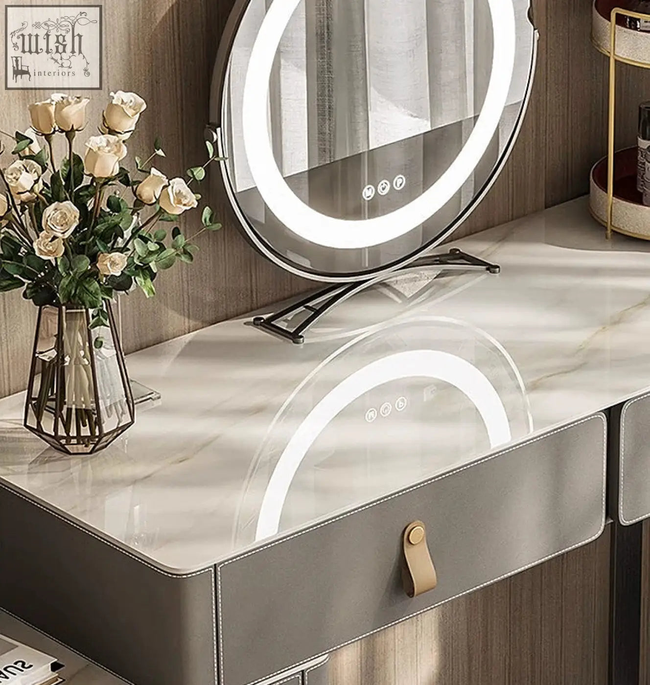 Circular vanity mirror with bright led ring light and sleek metallic frame on a grey dressing table for easy use