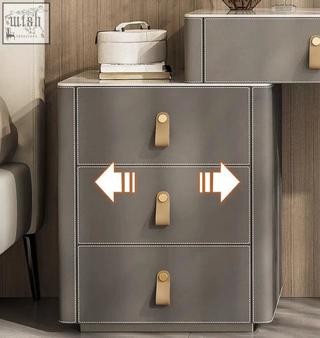 Grey faux leather dressing table nightstand with gold-tone handles and white stitching in sanchez vanity table