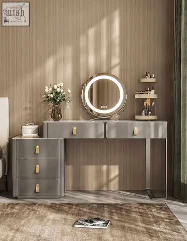 Modern grey dressing table with gold-tone drawer pulls and circular led mirror perfect for any dressing table setup