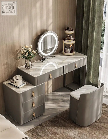 Modern grey dressing table with marble top, sleek drawers, wooden handles, and matching upholstered chair, ideal vanity table