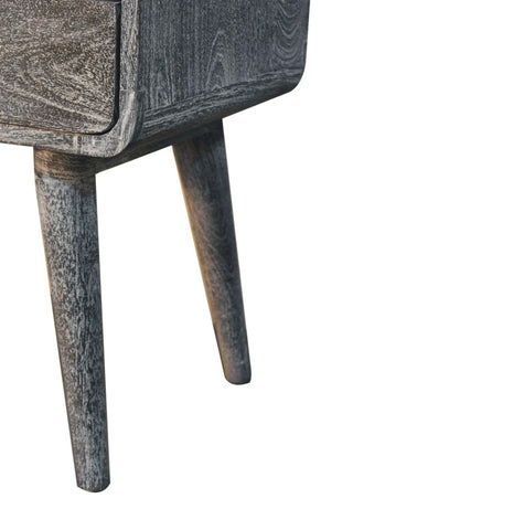 Gray-washed sandblasted ash curved bedside table with tapered legs and visible wood grain finish in ash curved style