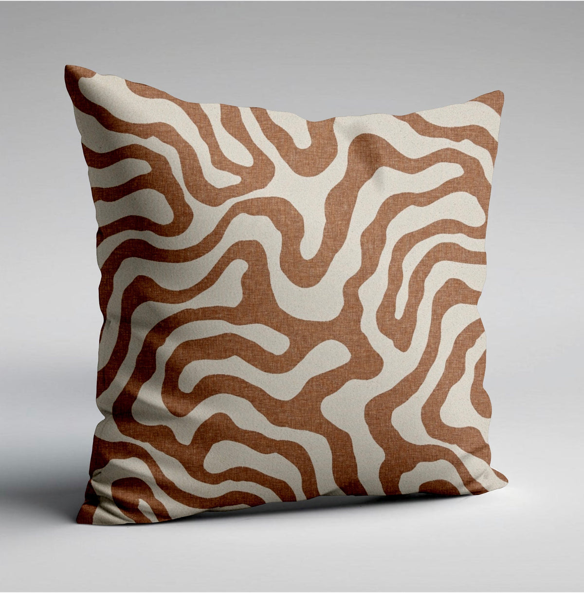 A sandstone wiggle throw cushion with bold brown and cream wavy lines on textured fabric perfect for scatter cushions