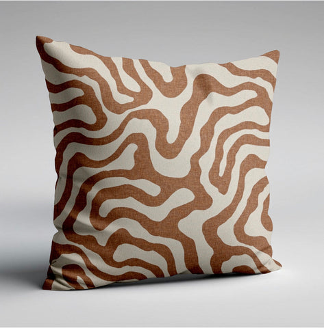 A sandstone wiggle throw cushion with bold brown and cream wavy lines on textured fabric perfect for scatter cushions