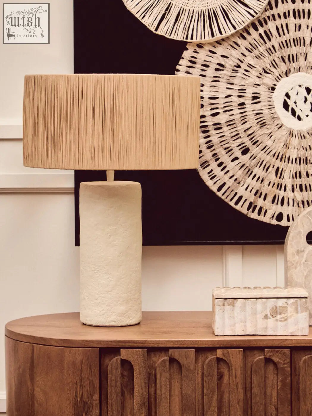 Beige textured ceramic table lamp with rectangular woven rattan shade beside santino rectangular chocolate marble box