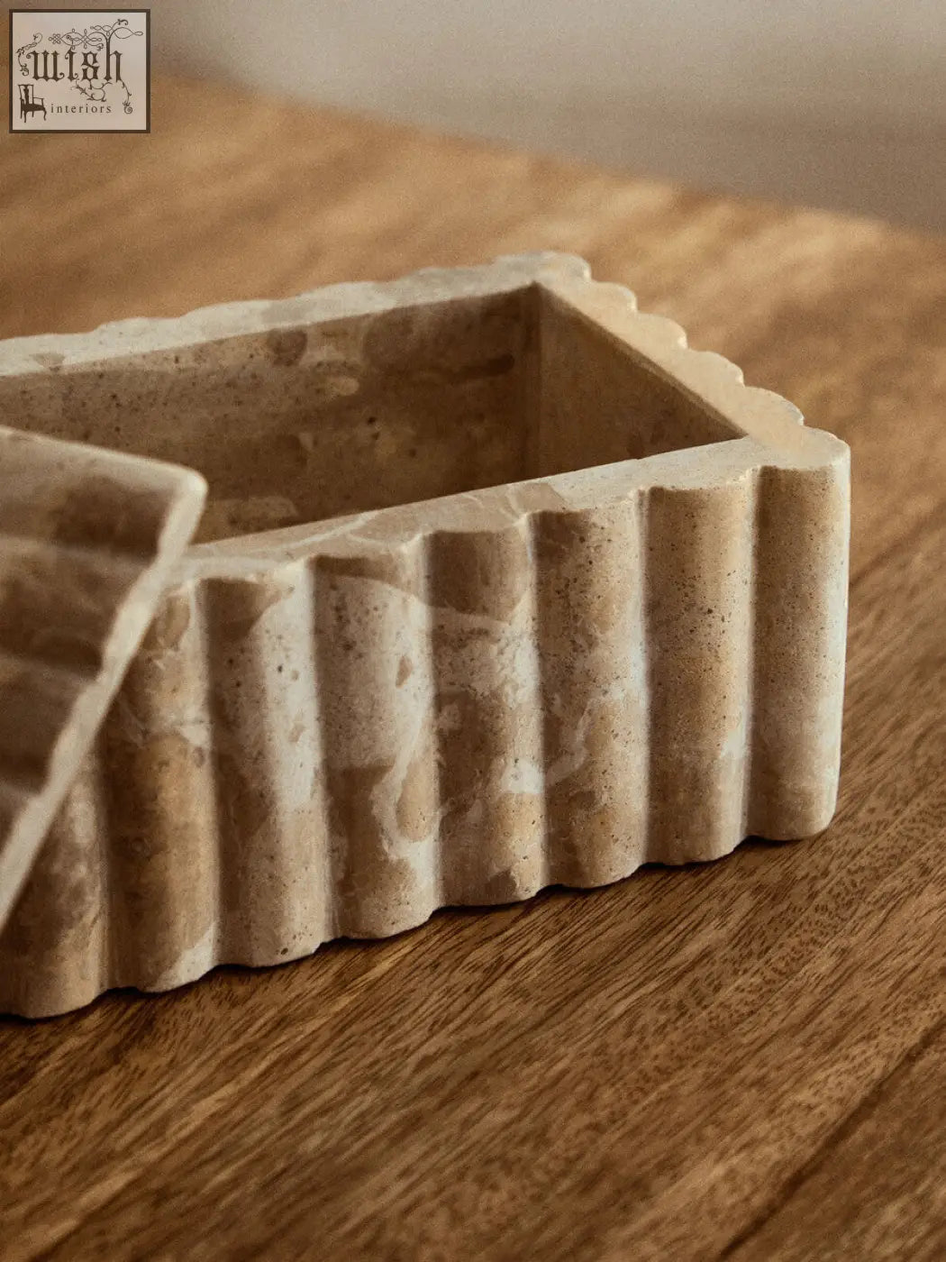 Beige stone rectangular chocolate marble box with fluted ridged sides and a textured surface santino marble box
