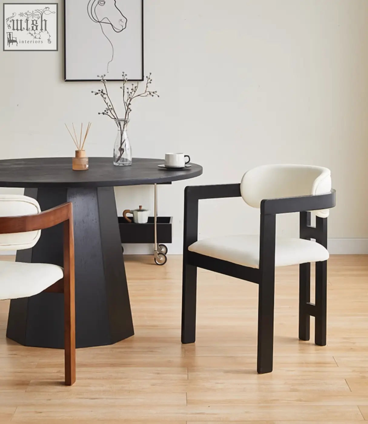 Black-framed sara dining chair with white upholstered seat and backrest perfect for coffee table set seating