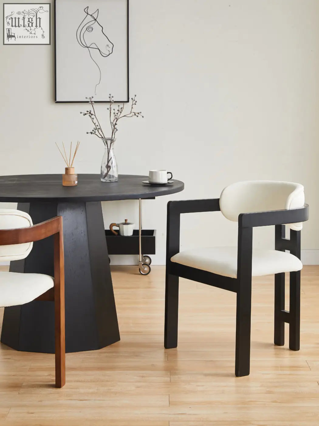 Black-framed sara dining chair with white upholstered seat and back perfect for your coffee table set or table set