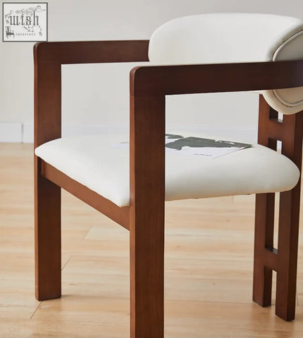 Sara dining chair wood with a minimalist brown wooden frame and plush white seat perfect for coffee table set areas